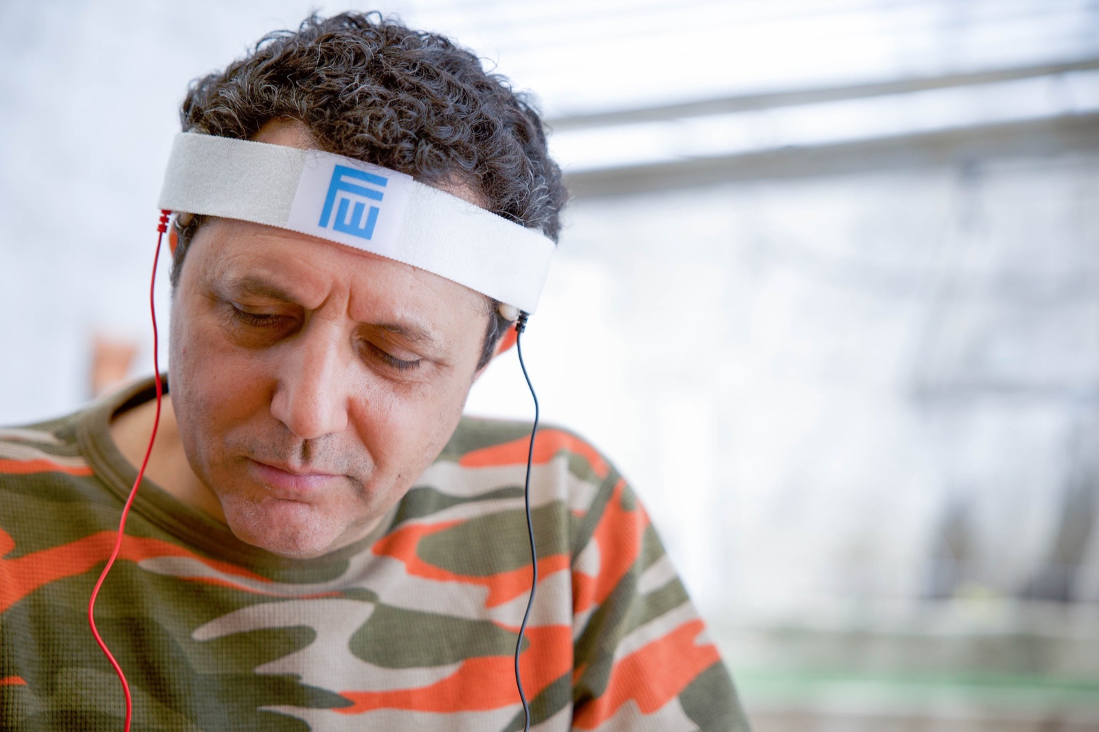 A man wearing the Fisher Wallace proof-of-concept headband